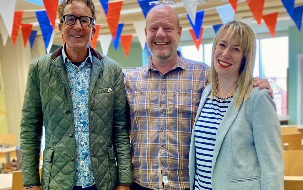Adam Holloway, director of Cheshire Dance has his arms around Peter Mearns and Holly Aston, new Co-Chairs of Cheshire Dance
